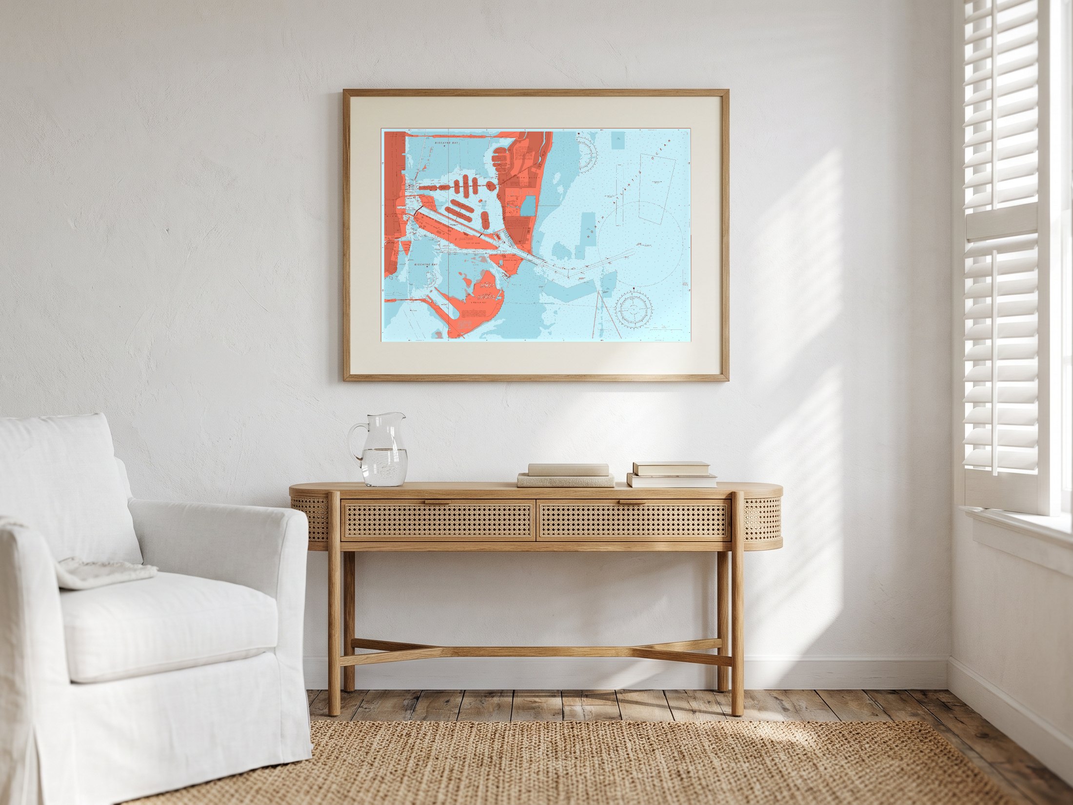 Miami Beach in Reef Break, framed above a cane console in a bright room