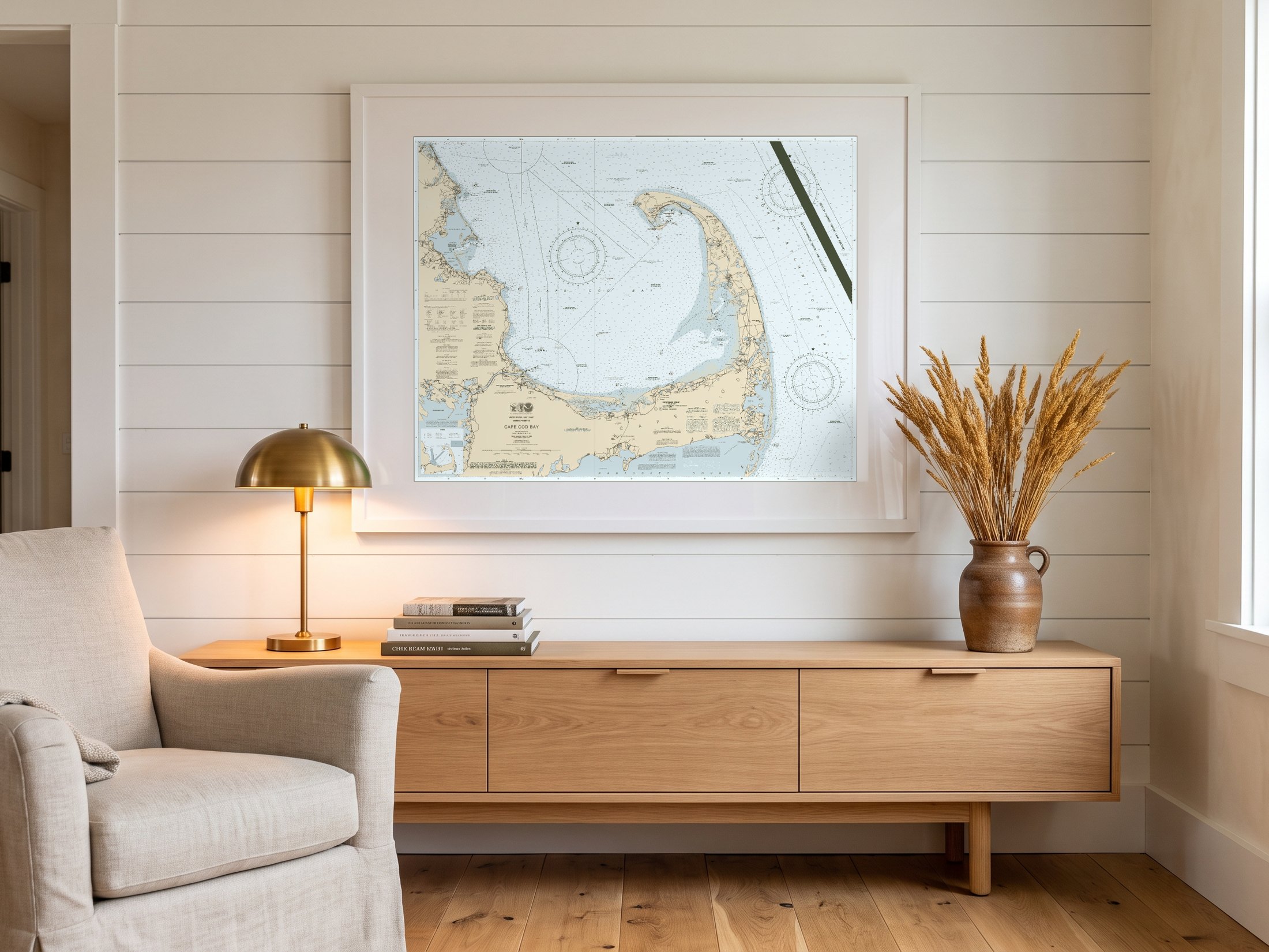 Cape Cod Bay in Charthouse, framed above a console in a shiplap room